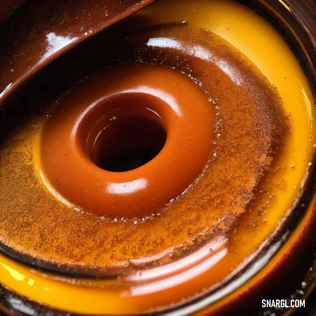 Brown and yellow bowl with a brown center piece in it's center