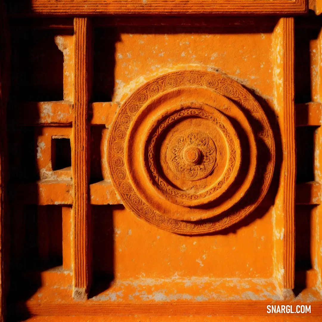 Close up of a circular object on a wall with a wooden frame and a metal ring on the center