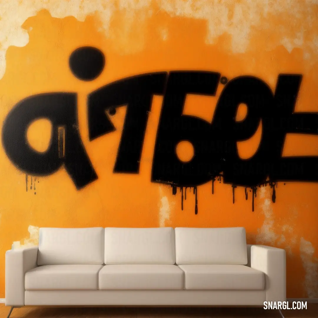 Couch in front of a wall with graffiti on it's side and a wall with a large black word on it
