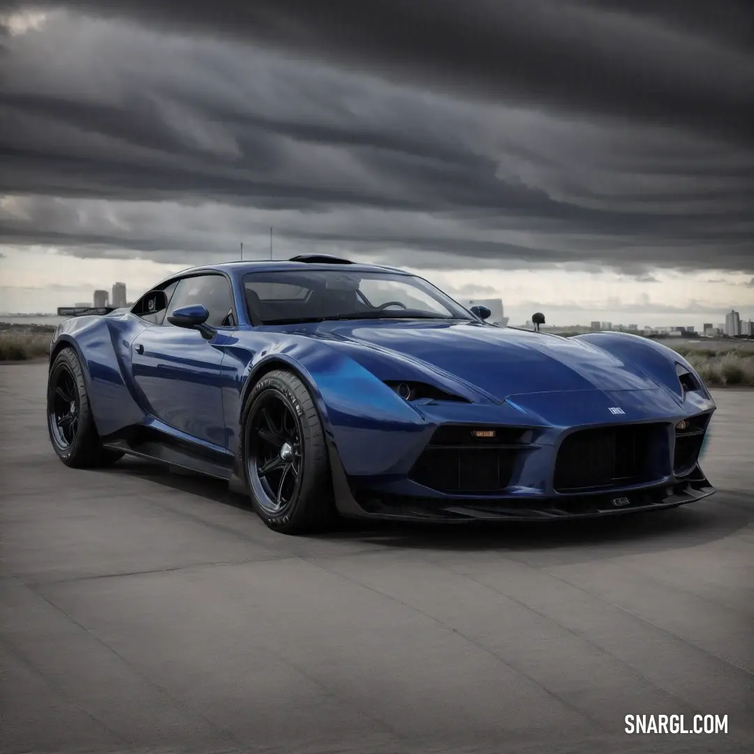 Blue sports car parked in a parking lot under a cloudy sky with dark clouds in the background. Color RGB 0,33,71.