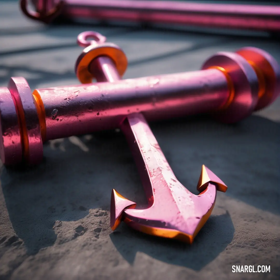 Pink anchor laying on the ground next to a pink pipe. Color Pale carmine.