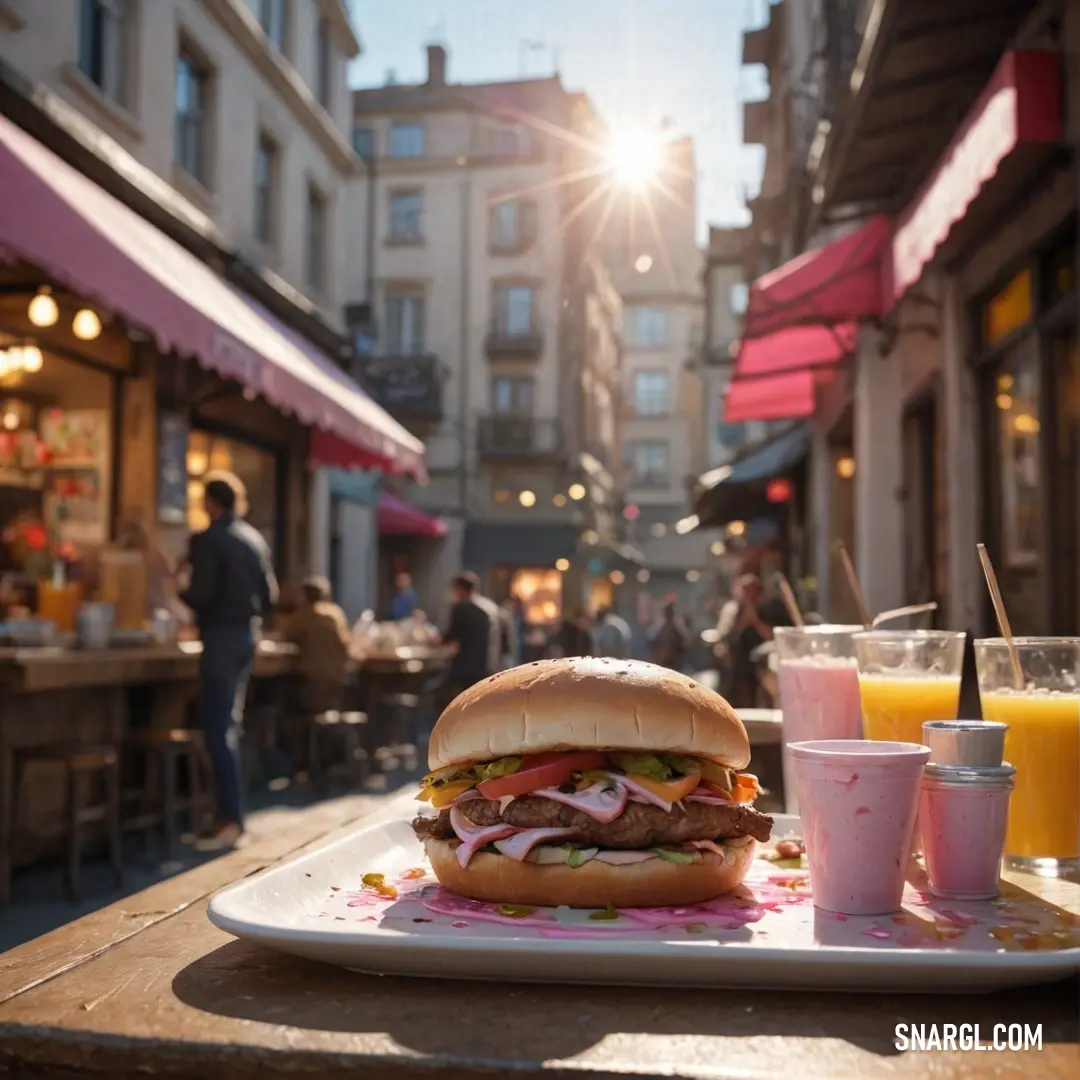 Sandwich and drinks on a table in a city setting with people walking by in the background. Example of #DDADAF color.