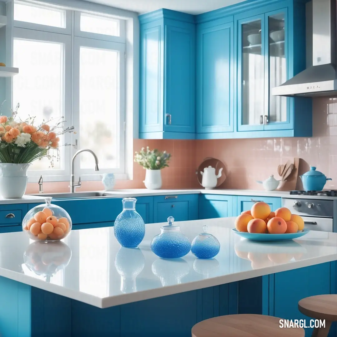 Kitchen with blue cabinets and a white counter top with oranges on it and a vase of flowers. Example of #ABCDEF color.