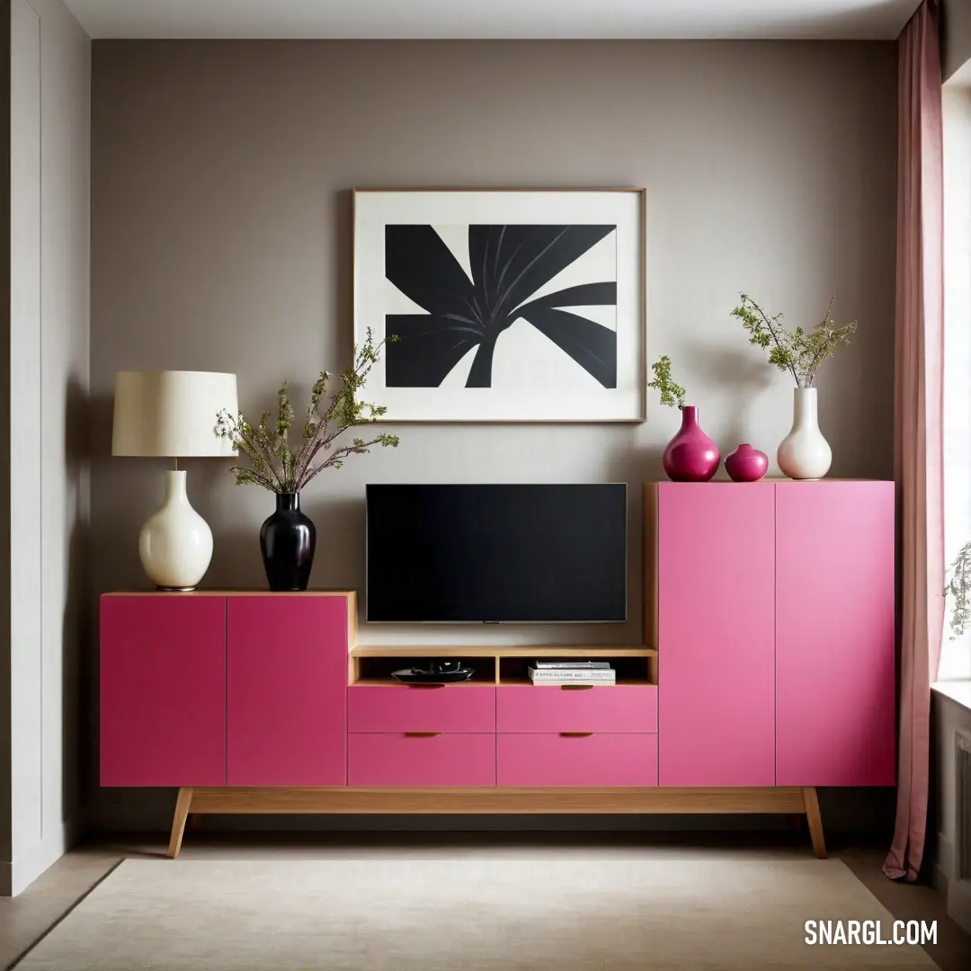Living room with a pink entertainment center and a painting on the wall above it and a lamp on the side. Color CMYK 0,49,33,14.