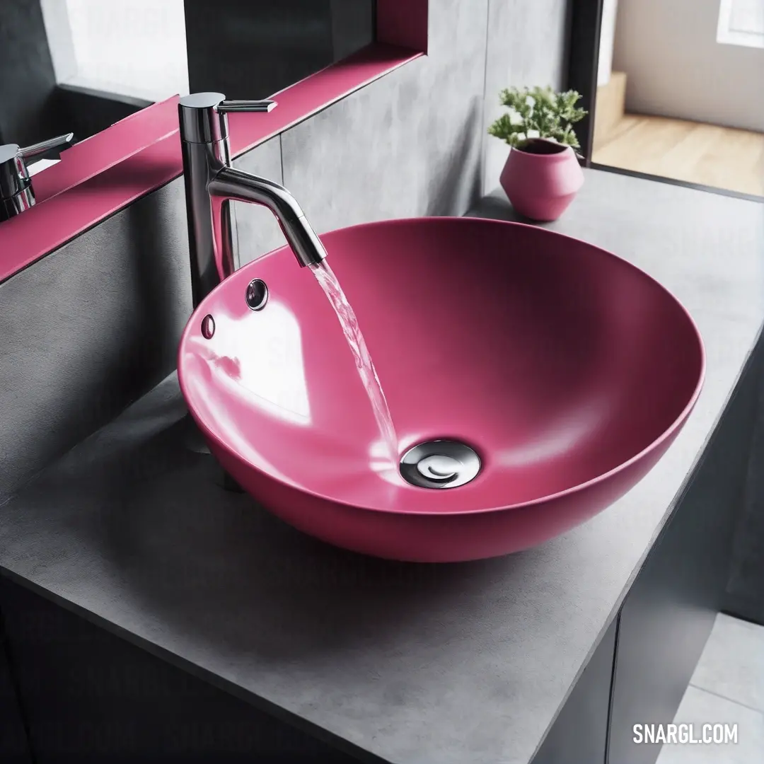 Pale red-violet color. Pink sink on top of a counter next to a mirror