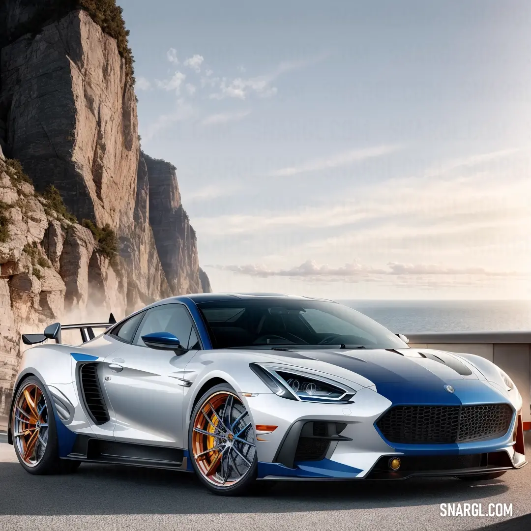Silver sports car parked on the side of a road near a cliff and ocean with a cliff in the background