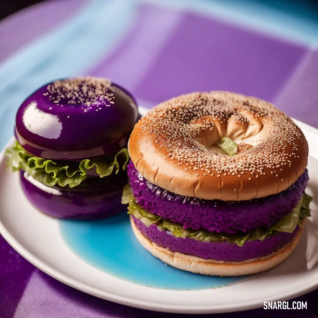Purple and white plate with a purple and white sandwich and a purple donut on it and a purple and white plate