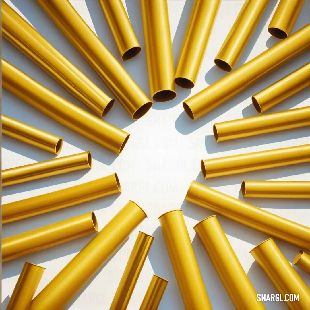 A striking arrangement of gold tubes artistically placed in a circular formation on a clean white surface, each tube reflecting light beautifully. This image highlights the elegance of simplicity and design.