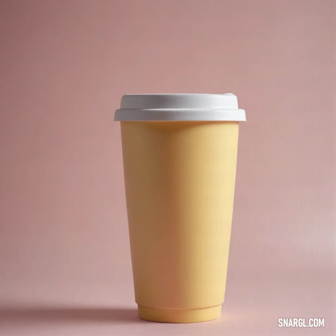 A vibrant yellow cup crowned with a pristine white lid, beautifully poised against a playful pink backdrop. This delightful combination creates a refreshing scene, perfect for anyone who appreciates joyous aesthetics.