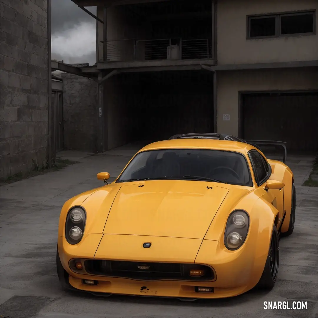 Yellow sports car parked in a parking lot next to a building with a garage door open and a dark sky in the background
