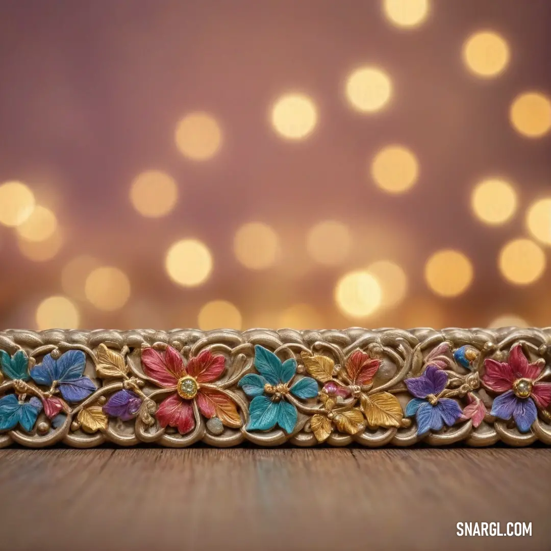 A stunning decorative ribbon in shimmering gold and gentle blue, adorned with floral designs. Set against a softly blurred background, it radiates elegance and charm with its rich gradation of RGB 230,138,72 hues.