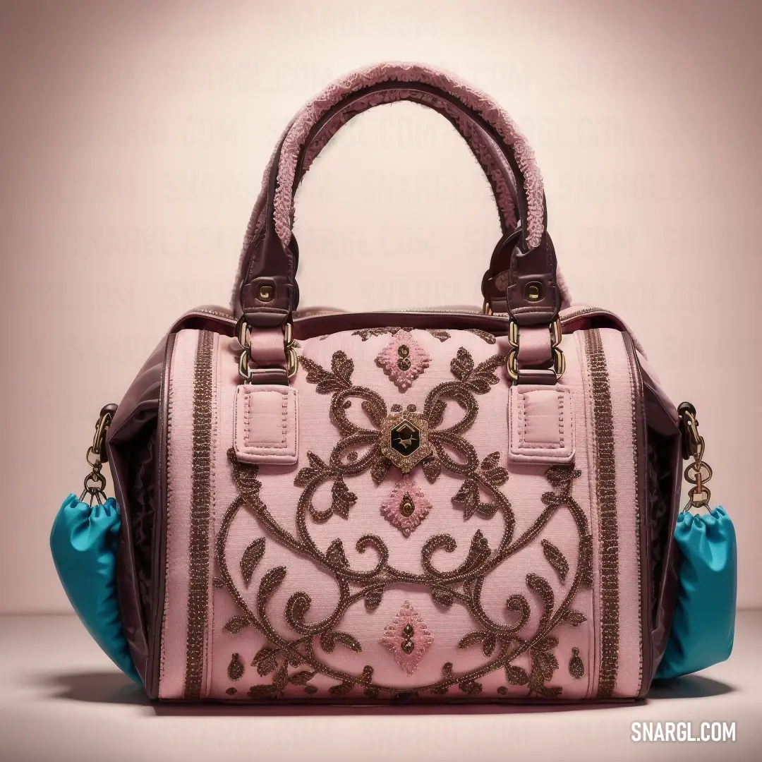 Pink purse with a blue handle and a flower design on it's side