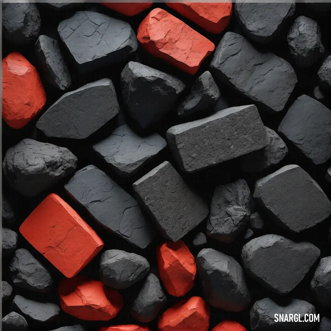 A striking display of rocks layered intricately with red and black accents, framed elegantly with a black border, emphasizing the natural textures and colors in a captivating arrangement.