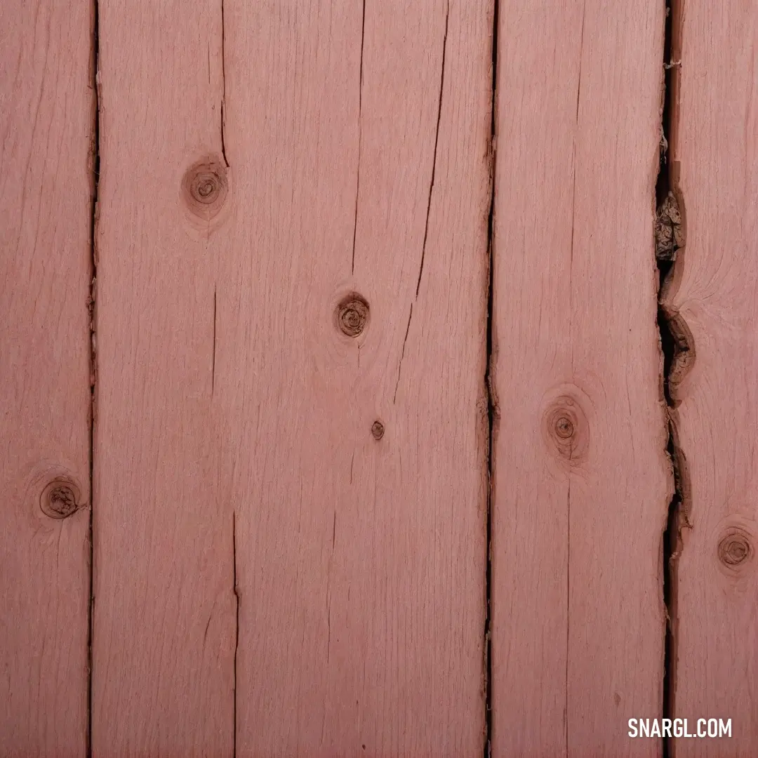 A rustic wooden surface sets the stage for a sleek cell phone resting on its side, paired with a vivid red stop sign nearby. The scene highlights a beautiful harmony between modern technology and classic materials, drawing the eye with contrasting colors.