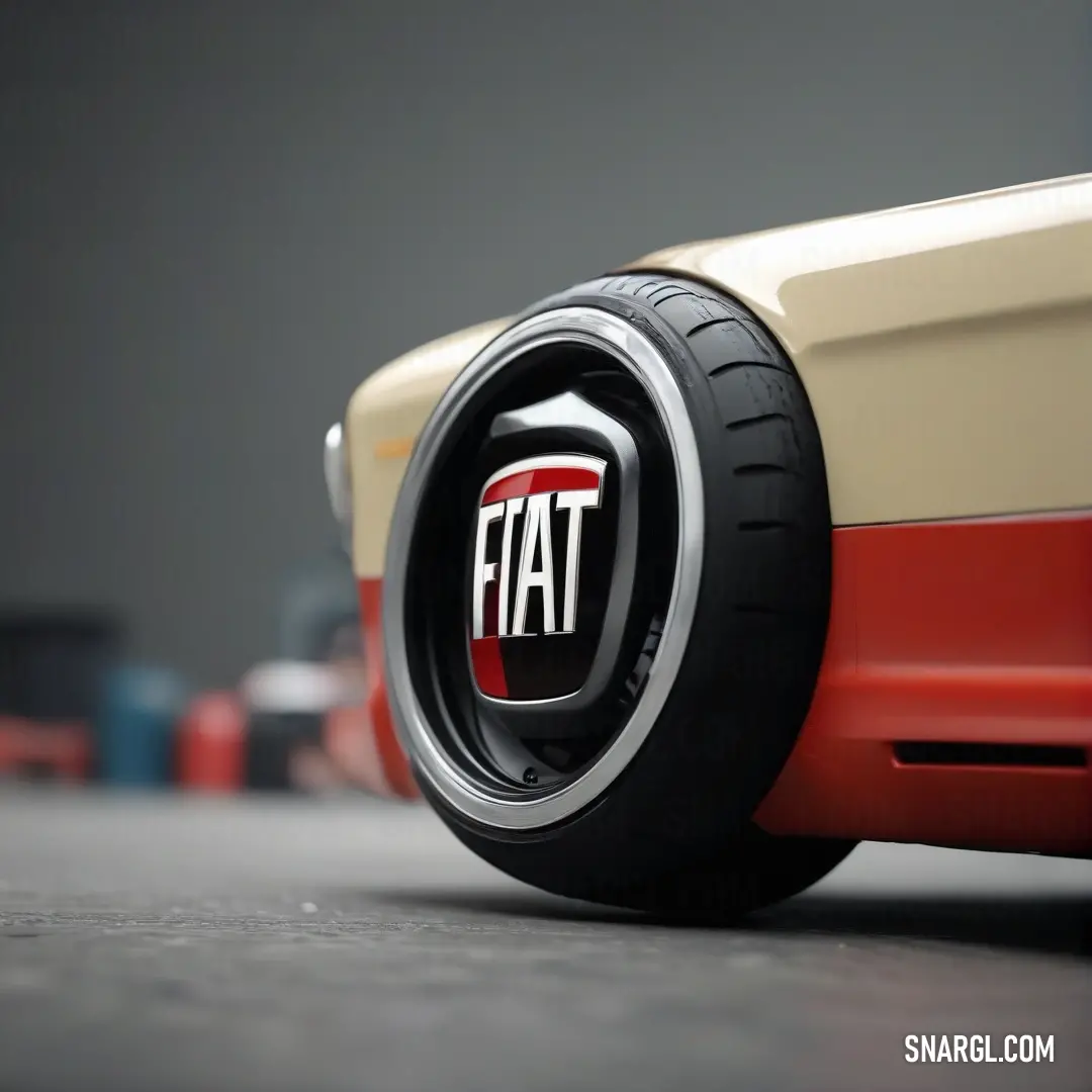 Detailed close-up of a car tire showcasing a prominent logo and a striking red and white racing stripe. The vibrant PANTONE 187 color adds a bold aesthetic, highlighting the intricacies of automotive design.