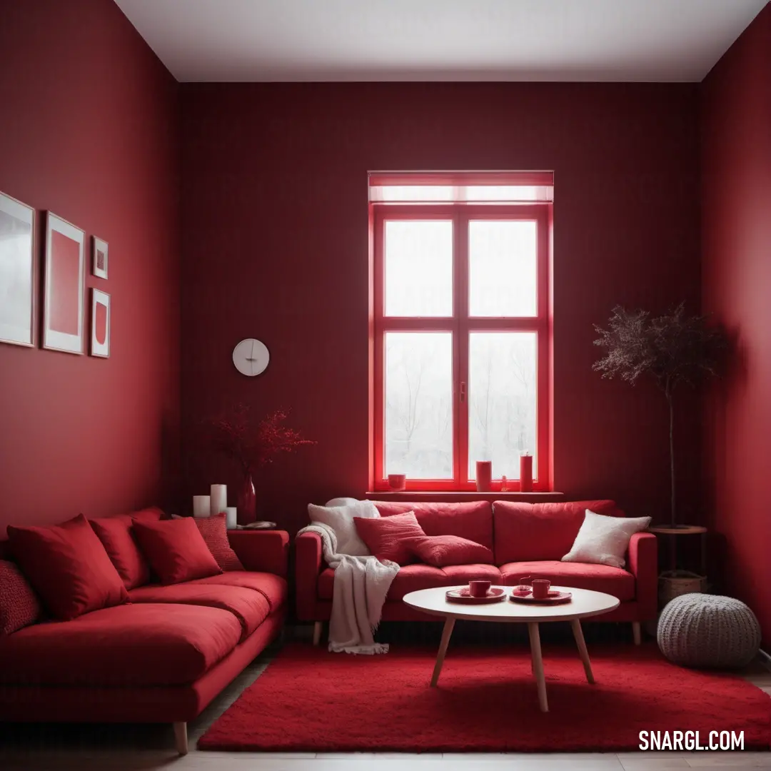 Living room with a red couch and a white table in front of a window with red curtains