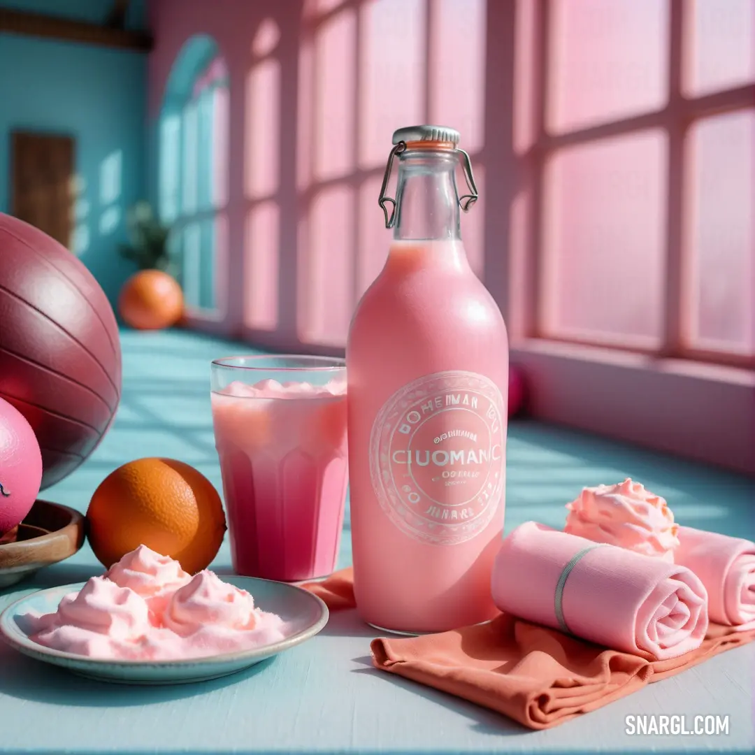 Pink bottle of liquid next to a plate of food and a glass of juice on a table with a ball and a pink towel