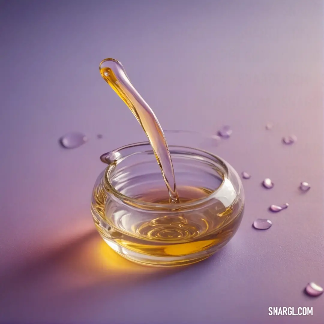 A picturesque jar of honey sits atop a table, with a spoon elegantly placed, surrounded by glistening water droplets and a captivating purple backdrop that enhances this sweet scene.