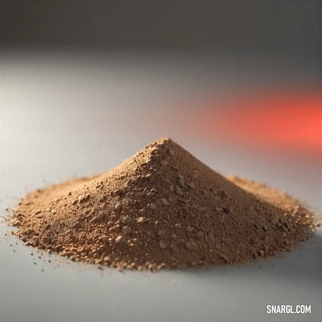 An intriguing image featuring a mound of dirt atop a table, brilliantly illuminated by a radiant red light. The juxtaposition of natural elements and modern fixtures creates a compelling visual narrative.