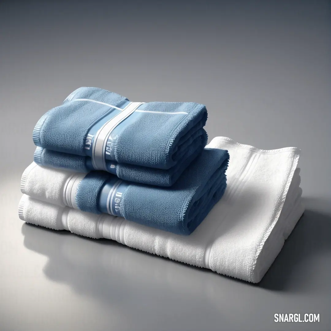 A stack of folded towels neatly arranged on a table against a simple gray backdrop. The soft folds and clean lines of the towels invite a sense of order and tranquility. The color palette features soft pastel shades like RGB 231,201,210, contributing to t