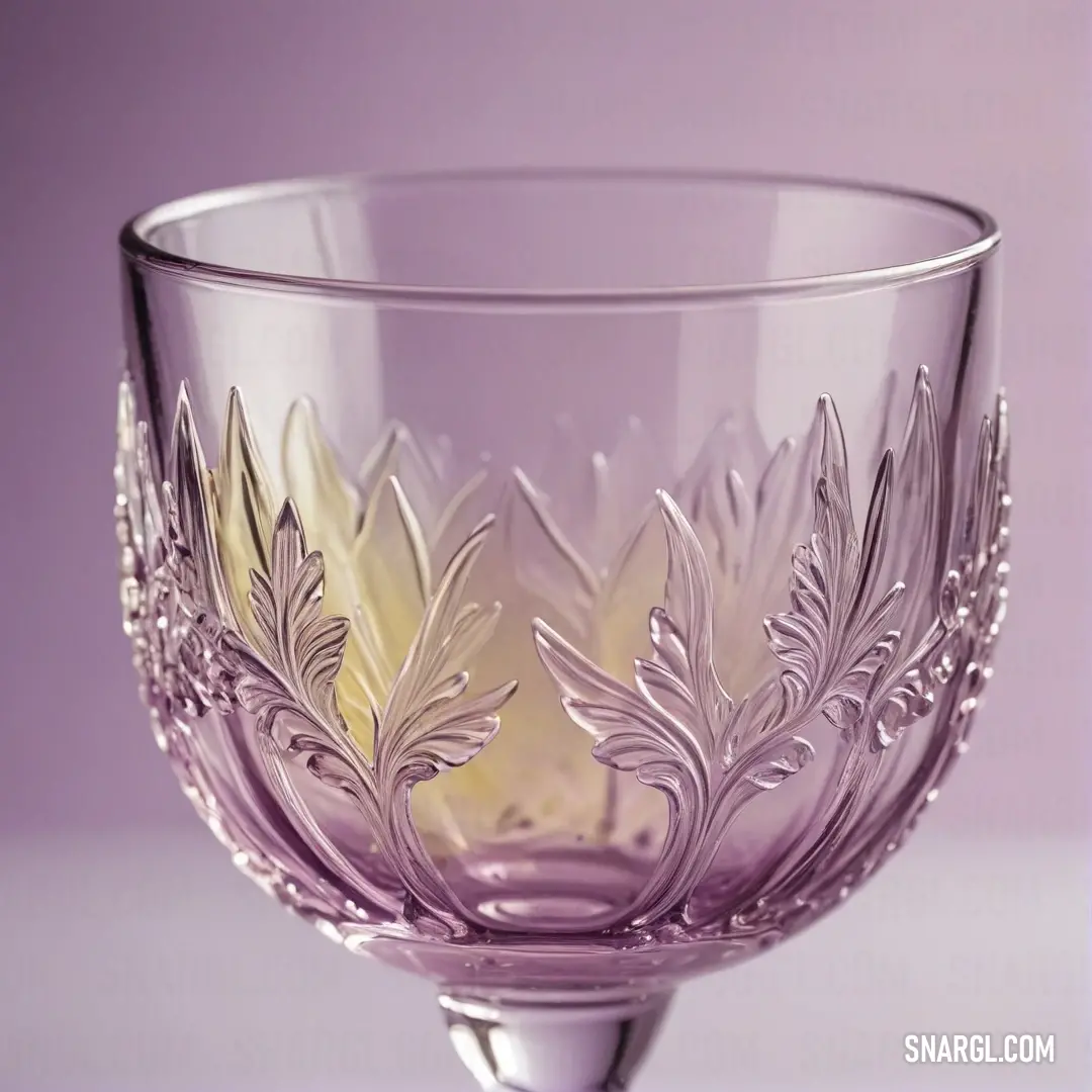 A stunning glass bowl, characterized by an intricate design, sits elegantly atop a table. The vibrant purple background enhances the bowl's color, imbuing the scene with a sense of artistry and sophistication.