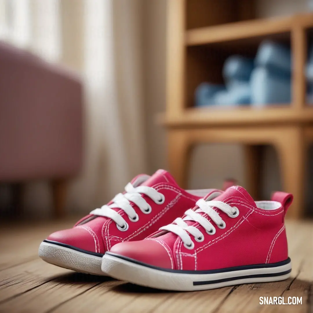 A fashionable pair of pink shoes elegantly rests atop a rustic wooden floor, alongside a stylish chair and a chic shelf, epitomizing casual sophistication.