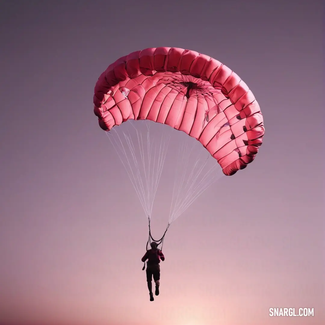 A person gracefully parasailing through the air at sunset or dawn, their parachute billowing in the wind. The rich PANTONE 206 color adds intensity to the scene, creating a vibrant contrast with the sky's hues and the person’s adventurous spirit.