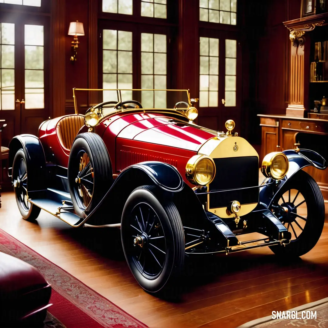 A striking red and black car positioned elegantly on a polished wooden floor beneath an expansive window that floods the space with natural light, highlighting its sleek design and the sophisticated #D82455 color.