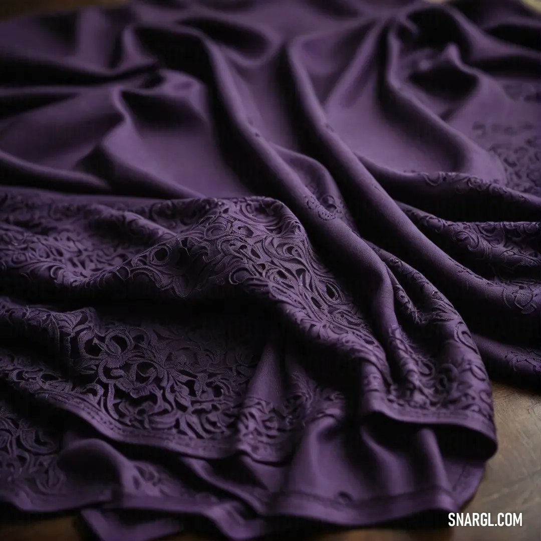 A beautifully patterned purple cloth drapes elegantly over a wooden table, complete with a knife and fork, radiating sophistication and inviting the viewer to visualize a delightful dining experience.