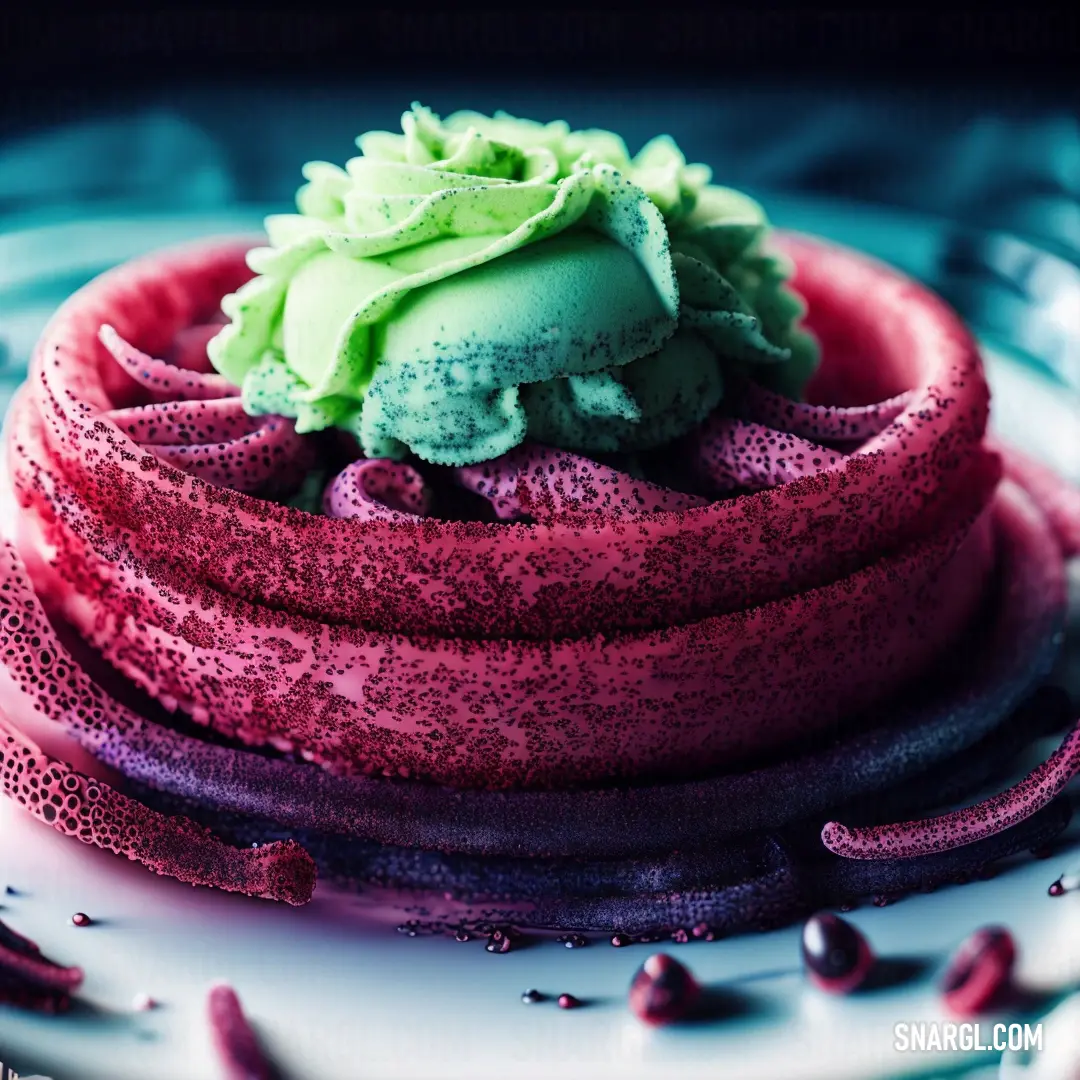 Cake with a green frosting on top of it on a plate with purple sprinkles