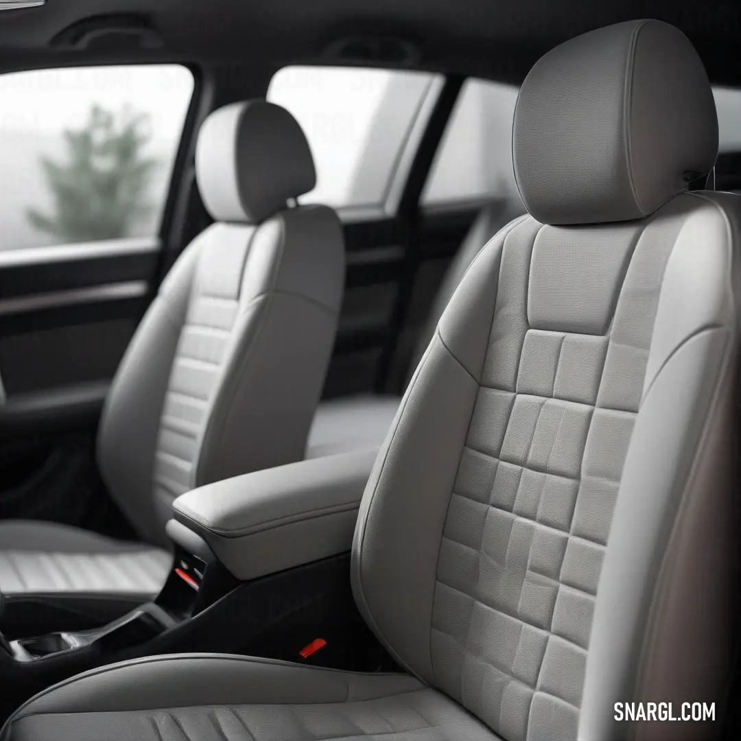 A stylish car interior featuring two rows of seats in the front, complemented by a spacious window at the back, allowing for ample light and a panoramic view of the surroundings.