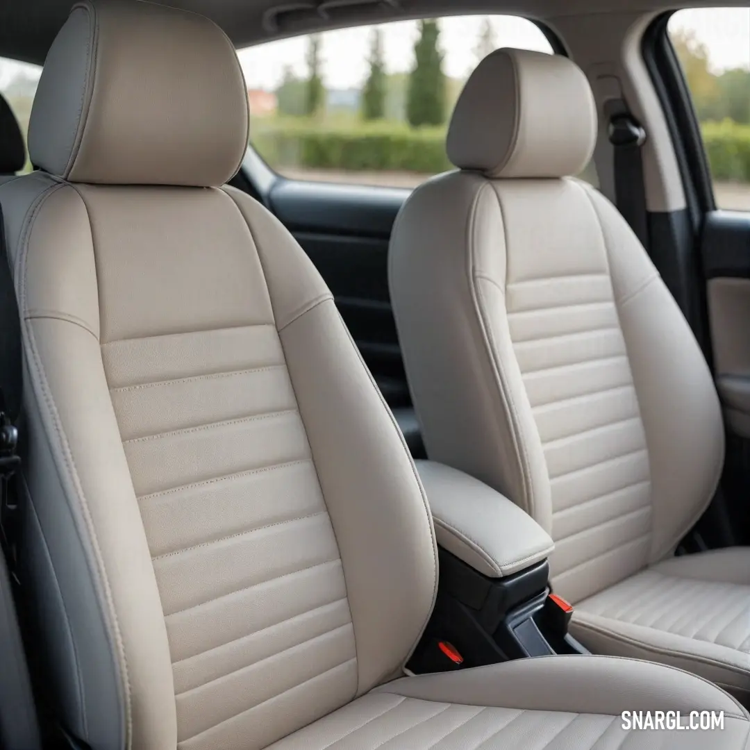 An elegant car interior focused on comfort, featuring two chic seats and a centrally positioned steering wheel that embodies luxury and accessibility for the driver.