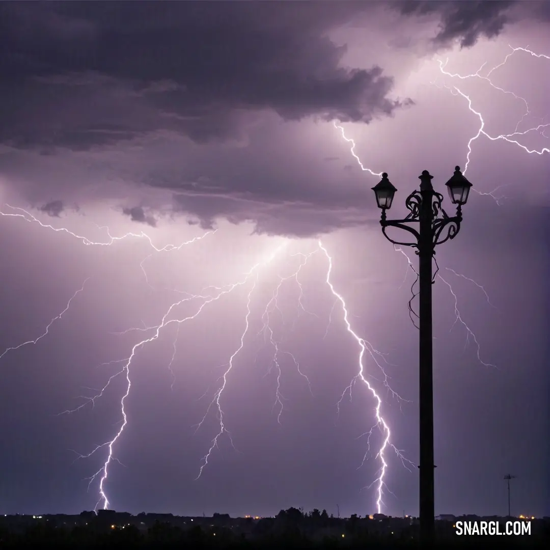 A solitary street light stands guard beneath a tumultuous sky filled with electrifying lightning, its glow illuminating the surrounding area. The vivid contrast between the dark clouds and bright bolts captures the dramatic essence of a stormy night.