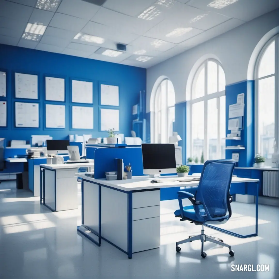 Blue and white office with a desk and chairs and a computer monitor and keyboard on a desk in front of a window