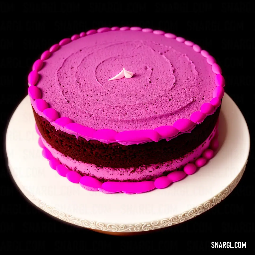 Cake with pink frosting on a white plate on a black background with a pink decoration on top
