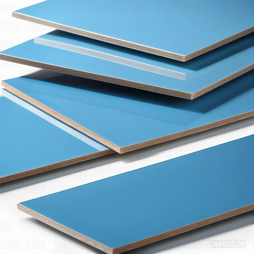 A neatly arranged stack of blue and white plywood sheets displayed against a bright white background, exemplifying the dynamic interplay of color and texture in woodworking materials.