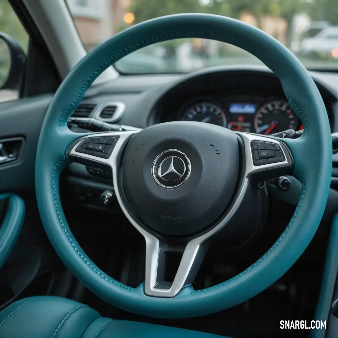 Experience the interior of a modern car featuring a sleek steering wheel and a well-designed dashboard illuminated by soft lights. The contrasting blue leather seats add a touch of luxury, enhancing the overall aesthetic with comfort and style.