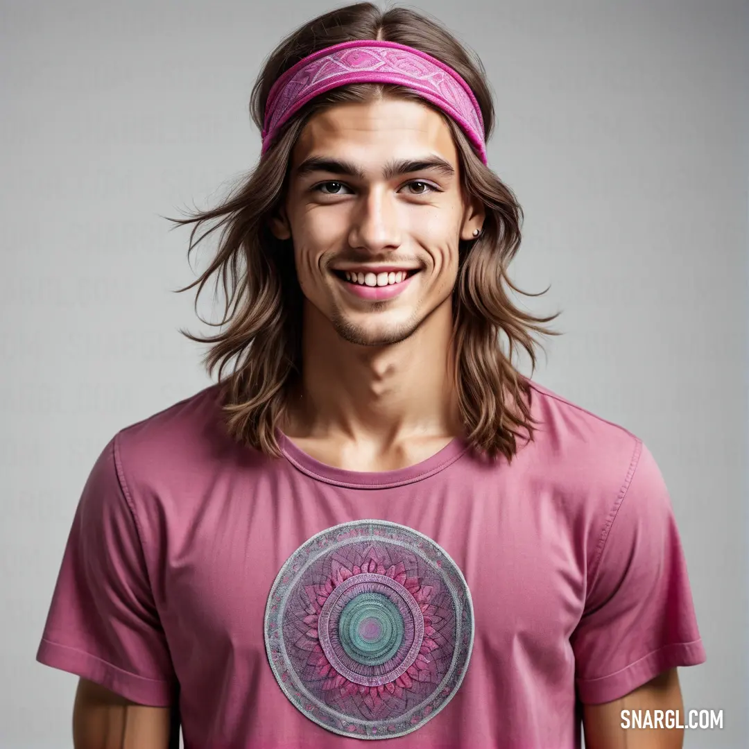 PANTONE 224 color. Man with long hair wearing a pink shirt and a pink headband smiles at the camera with a smile on his face