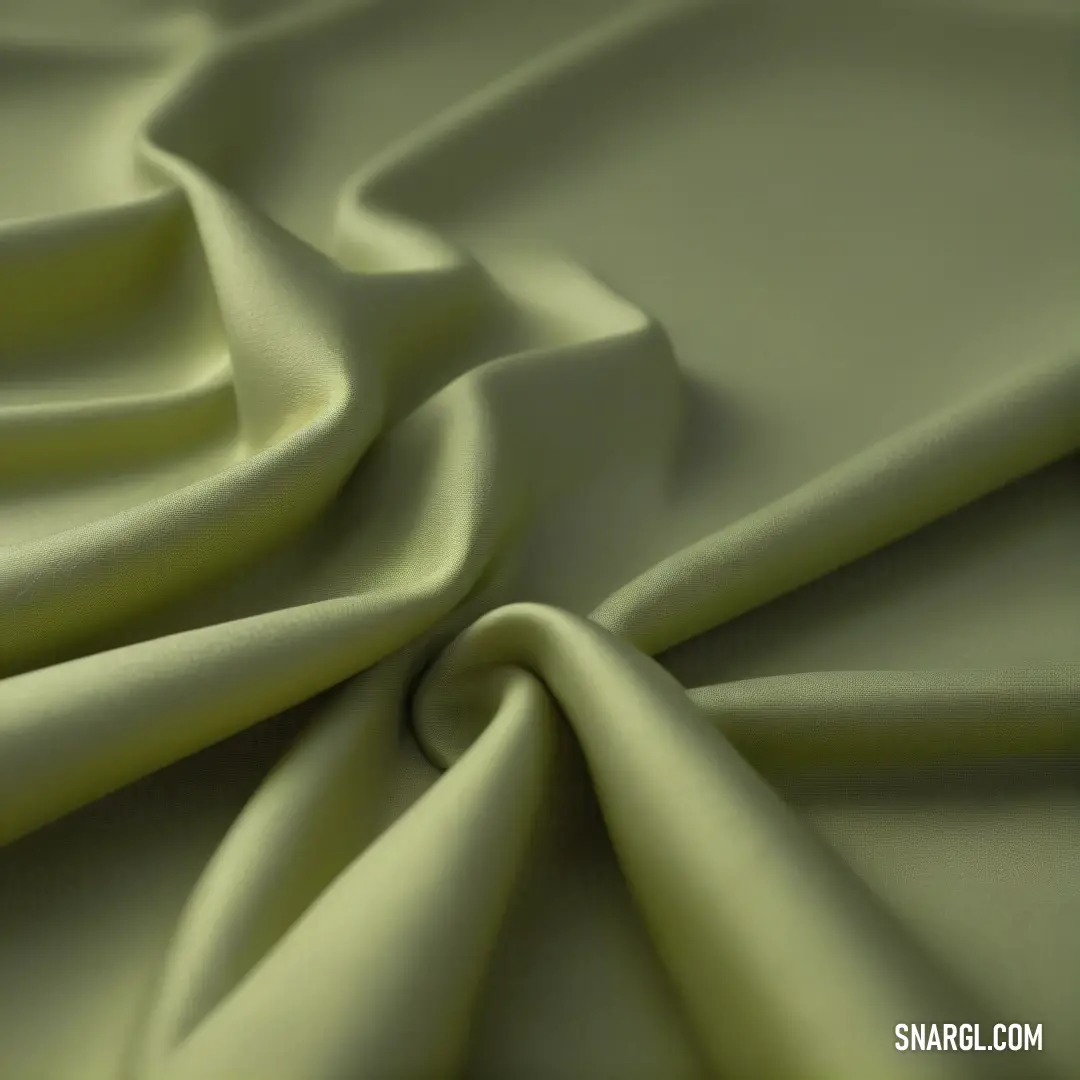 A close-up view of soft, green fabric with a luxurious texture. The material appears smooth and inviting, with a calming color that adds a touch of elegance to the scene.