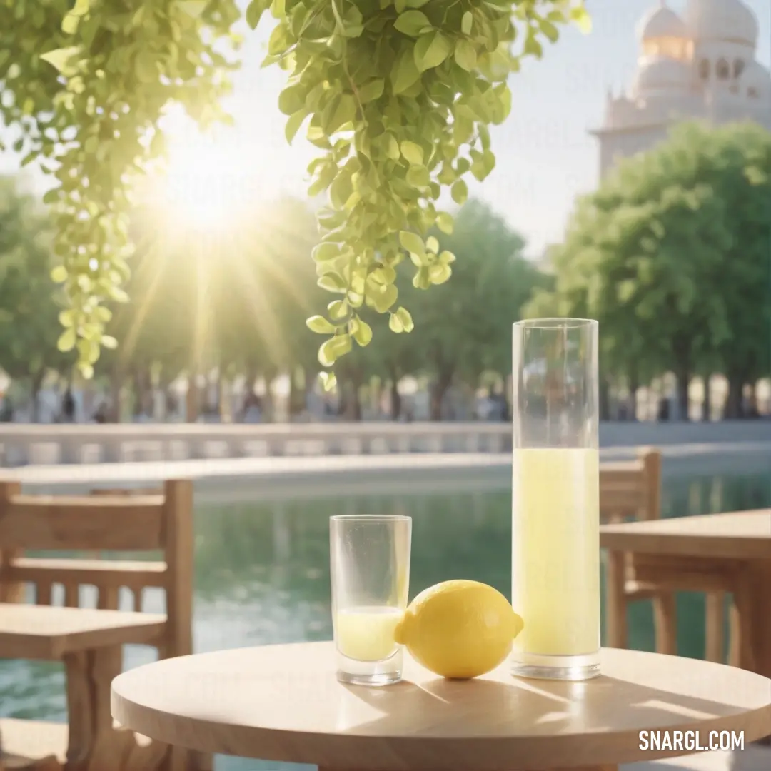 Table with a glass of lemon juice and a lemon on it with a view of a lake and a building. Color CMYK 24,0,57,0.