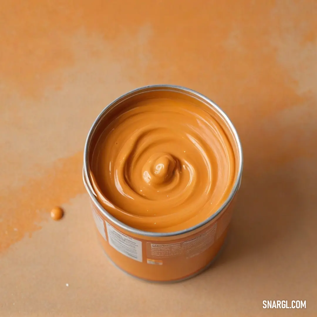 A can of orange food artfully placed on a tabletop made inviting by a warm brown background, demonstrating a vibrant contrast that evokes the homey essence of hearty, comforting cuisine.