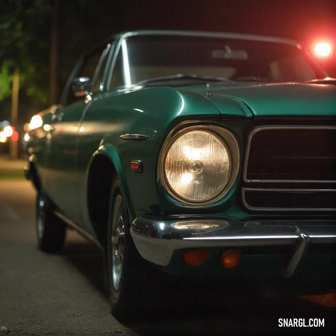 A captivating green car stands illuminated on the roadside at night, its headlights casting a bright glow amongst shadowed surroundings; the car showcases the rich hue of PANTONE 2328 against a dark backdrop.