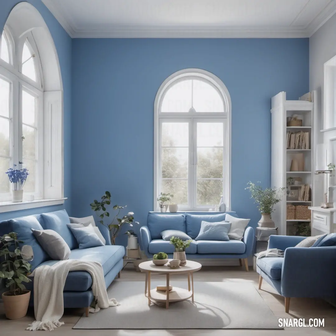 An elegantly designed living room with soothing blue walls and stylish furniture, framed by a grand arched window that floods the space with natural light.