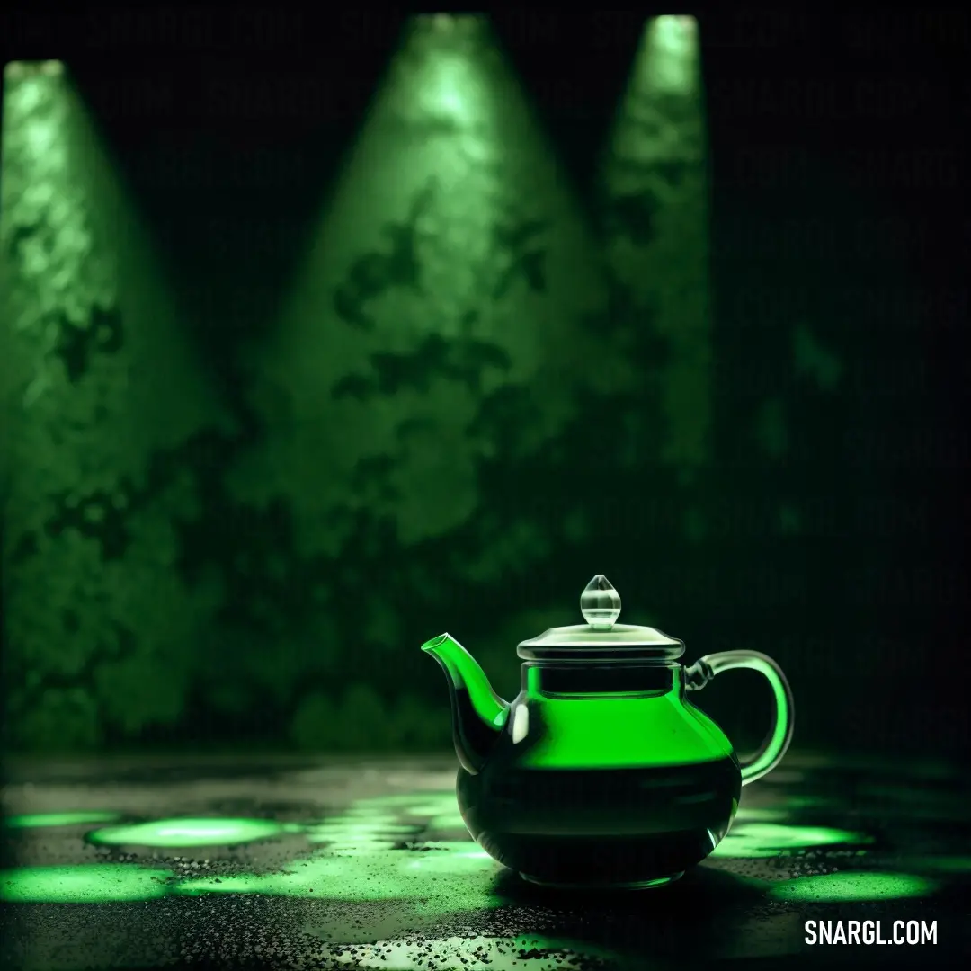 Green teapot with a black lid and a green light in the background. Example of CMYK 80,0,100,0 color.