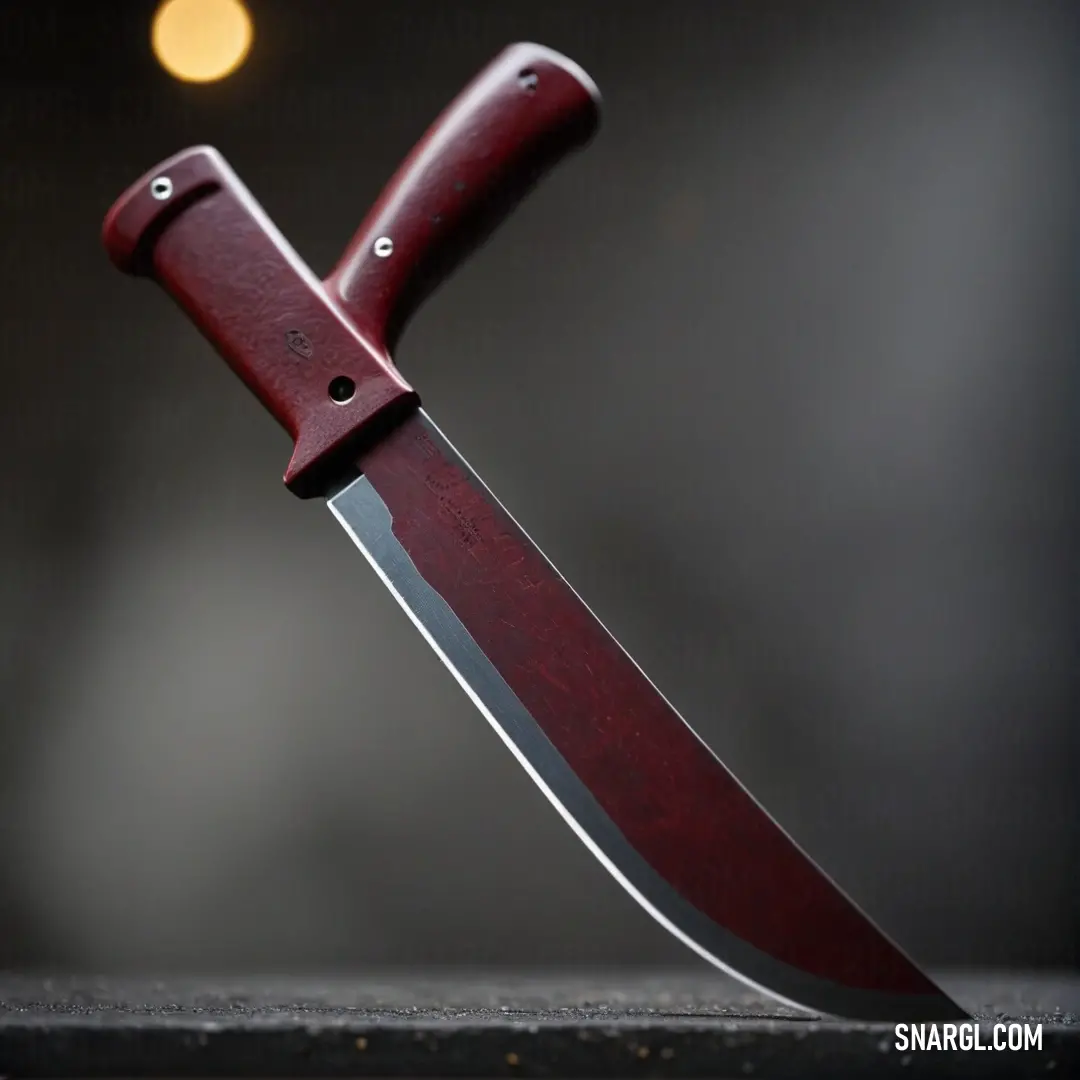 A striking red knife with a beautifully crafted wooden handle rests elegantly on a table, its vibrant color contrasting with the softly blurred background, creating an inviting atmosphere for culinary adventures.