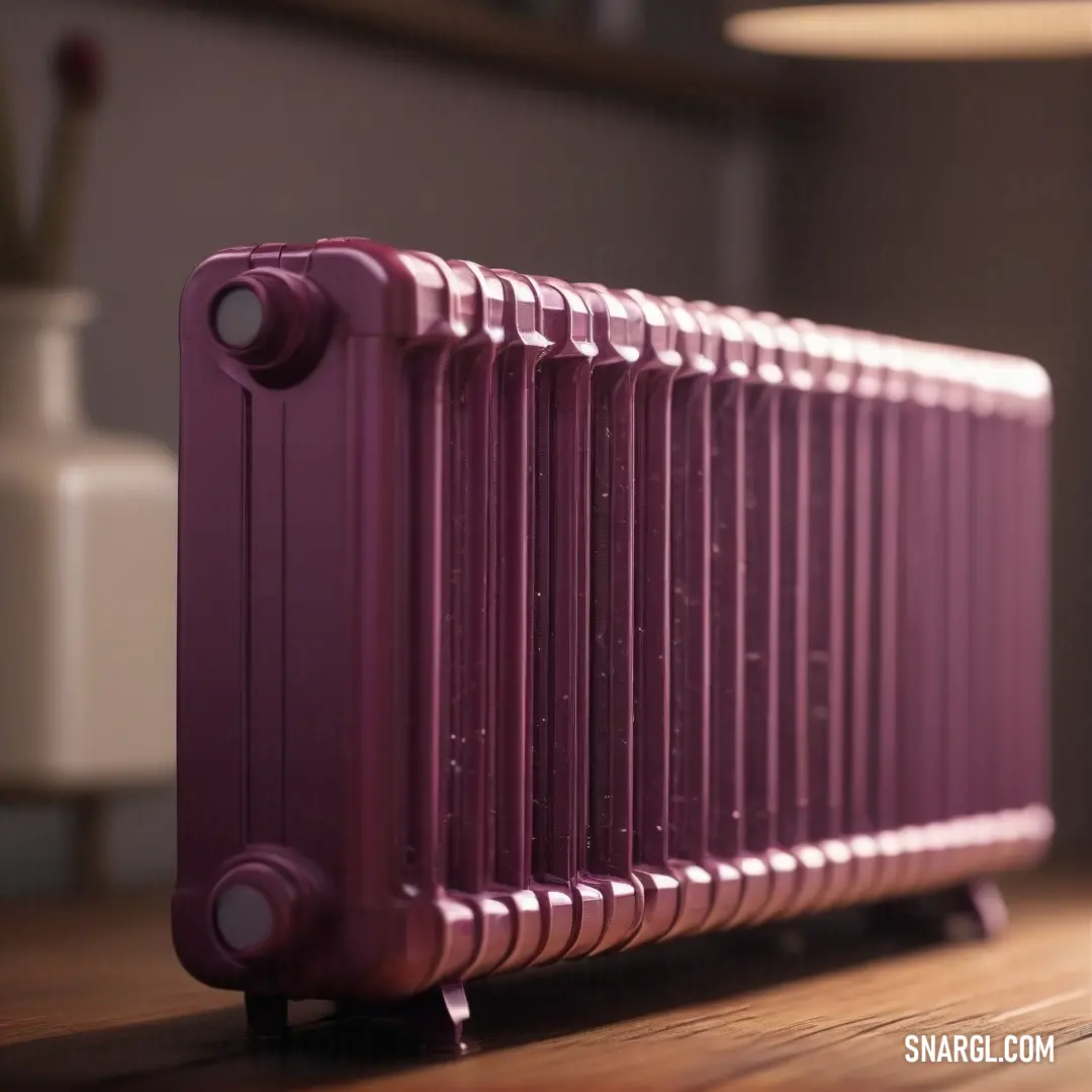 A vivid purple radiator sits against a wooden floor next to a cozy lamp and a vase filled with colorful flowers, creating a warm, inviting atmosphere.