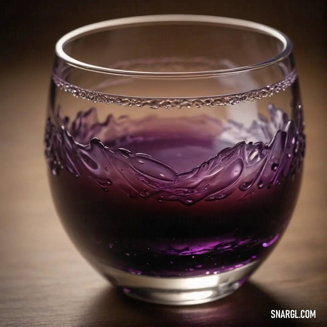 A sophisticated glass filled with a vibrant purple liquid, delicately resting on a rustic brown table. The rich hues create a stunning visual contrast, exemplifying the vibrant CMYK 65,100,5,40 color palette.