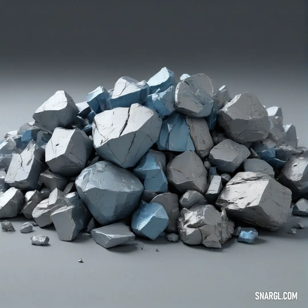 A pile of smooth, weathered rocks stacked on a wooden table, positioned near a muted gray wall. The simple scene evokes a calm, serene atmosphere, showcasing the natural texture and colors of the rocks against the clean, modern backdrop.