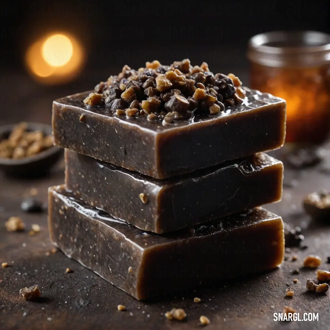 A hearty stack of mouthwatering chocolate bars embellished with crunchy nuts, next to a glistening jar of honey syrup and a matching spoon, creating a delightful feast for the senses that excites and entices.