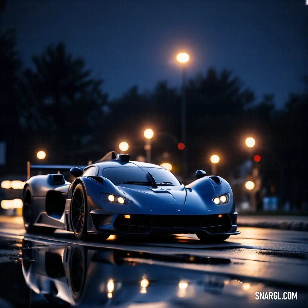 PANTONE 2756 color example: Blue sports car driving down a wet road at night with street lights in the background